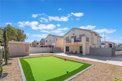 Rear view of property featuring a fenced backyard,