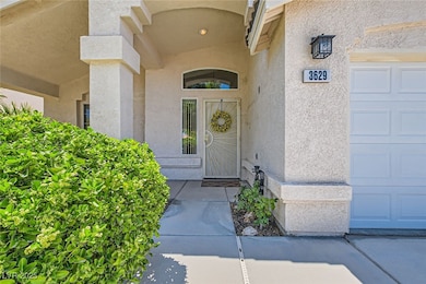 Entrance to property with stucco siding and a gara
