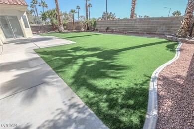 View of yard with a fenced backyard and a patio ar