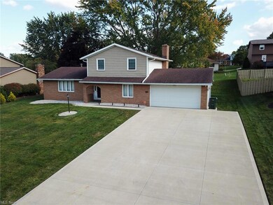 View of front of property with a front yard and a 