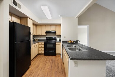 The kitchen has numerous cabinets and pantry for s