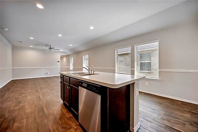 Island with sink and breakfast area.
