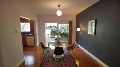 Formal dining opens out to beautiful rear deck for