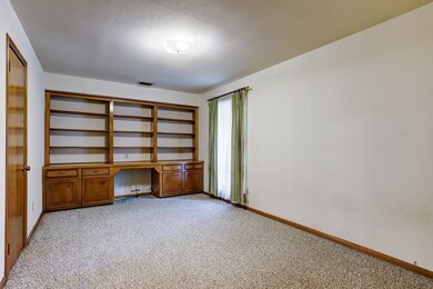 On the opposite side of the foyer is a roomy study