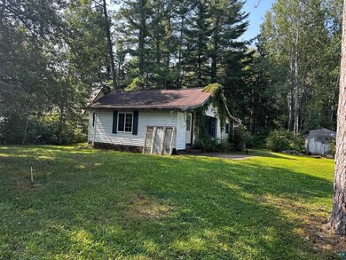 View of front of property with a front yard