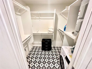 Spacious closet featuring washer / dryer
