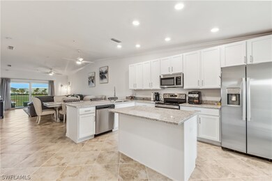 Kitchen featuring kitchen peninsula, white cabinet