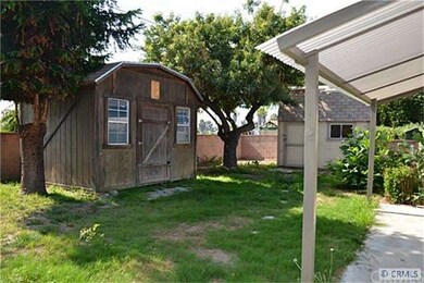 Large yard with 2 bonus storage units.