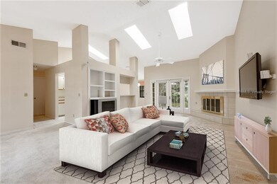 This ideal floor plan showcases HIGH CEILINGS, BUILT-IN SHELVES, WOOD-BURNING FIREPLACE, and abundant windows allowing NATURAL LIGHT to shine in. Virtually staged.