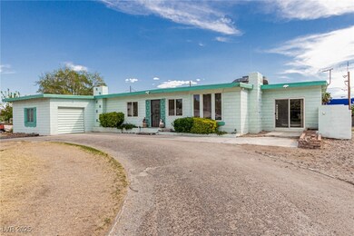 Ranch-style house featuring driveway and an attach
