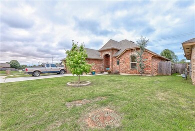 Side view with trees in front yard.