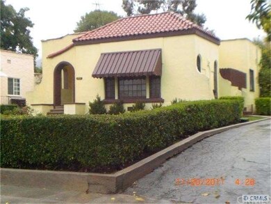 Side driveway to the back of the home has a gate t