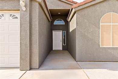 View of exterior entry featuring stucco siding
