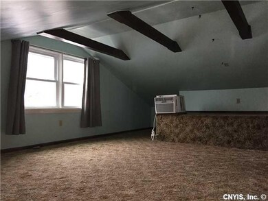 Loft. Additional storage area open to living room.