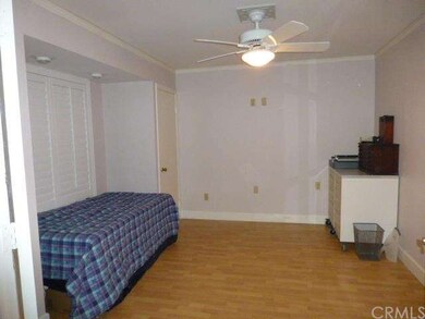 Downstairs bedroom or office with plantation shutt
