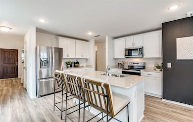 High-end gourmet kitchen with premium finishes and upgraded appliances *Model representation
