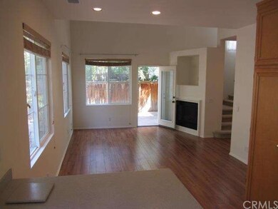 Spacious living room features high ceilings and a 