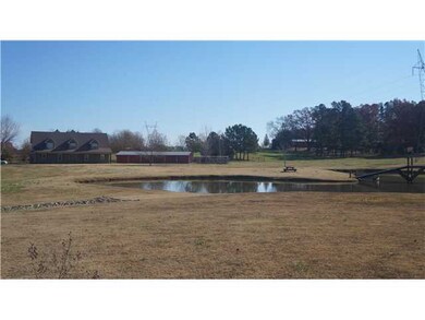 View Of The Front Of Property With Pond