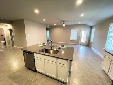 Kitchen breakfast island open to the family room.
