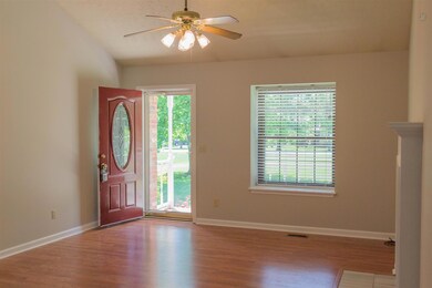 Hardwood floors invite you to come in and visit a while.