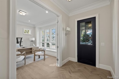 Entrance foyer with crown molding, healthy amount of natural light, and recessed lighting