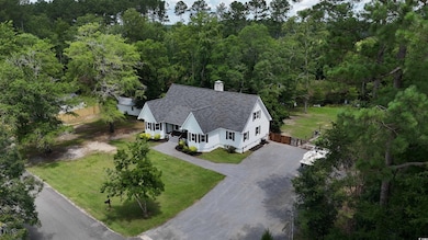 View from above of property featuring a forest