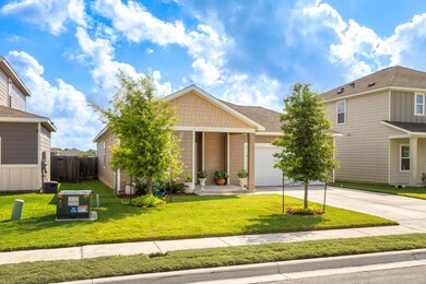 View of front of house with an attached garage and concrete driveway