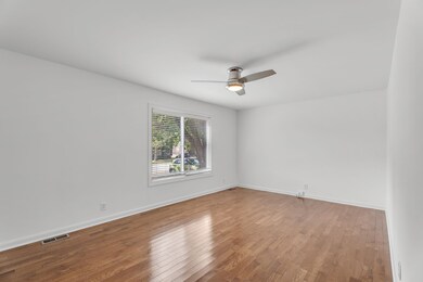 View of Den without virtual staging. Whether you envision a Formal sitting area, second Living Room, Home Office or Home Gym - you have plenty of room!