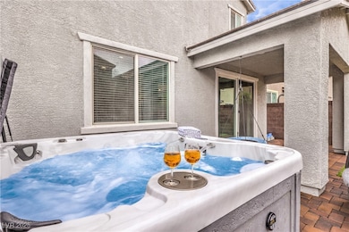 View of patio featuring a hot tub