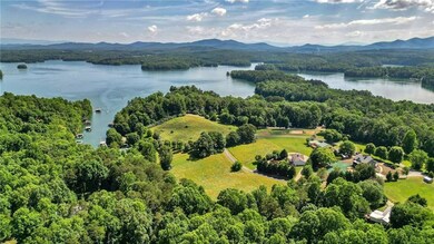 Drone / aerial view with a water and mountain view
