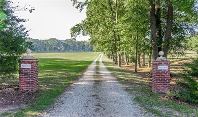 A welcoming entrance from Paynes Mill Road, the home sits on a slight rise well back from the road.