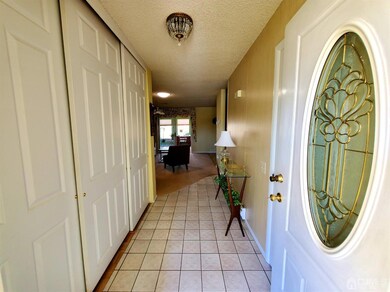 Front Entrance Hallway with Closet and Half Bath