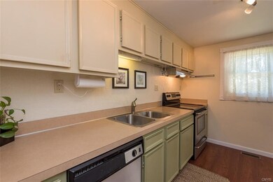Moving into the kitchen, we find tranquil hues and
