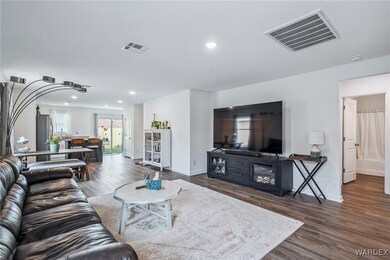 Living area featuring recessed lighting, visible v