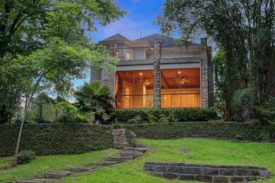 A view of the rear of the home with a covered and