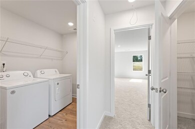 Laundry area with laundry area, visible vents, bas