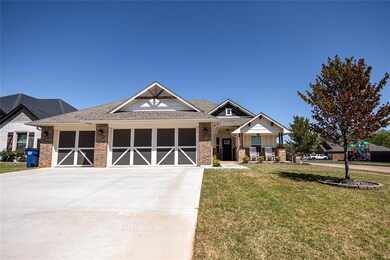 Craftsman inspired home with a garage, a front yar