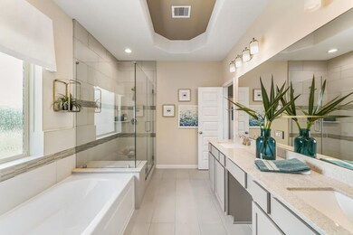 Primary luxury bath with double vanity, shower and soaking tub