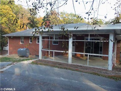 Exterior Back - Back of house. Screen porch missing screen.