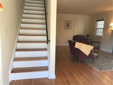 Entry is inviting with hardwood floors