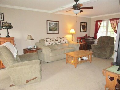 The family room is spacious and offers a lot of natural light with a double window at the back and two windows at the front!