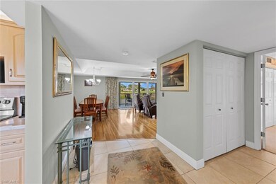 Hallway featuring light tile patterned flooring an