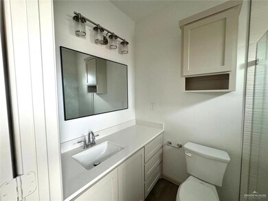 Full bath with toilet and vanity