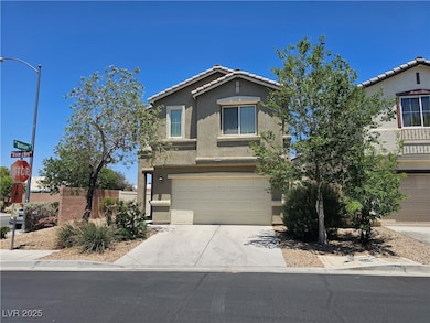 View of front of home with stucco siding, a garage