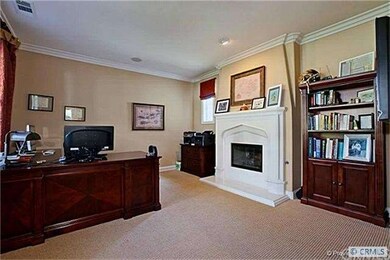 Downstairs office/den with fireplace.