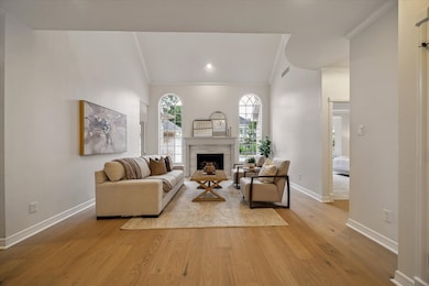 THE GRAND FAMILY ROOM BOASTS UPDATED FLOORING, UPD