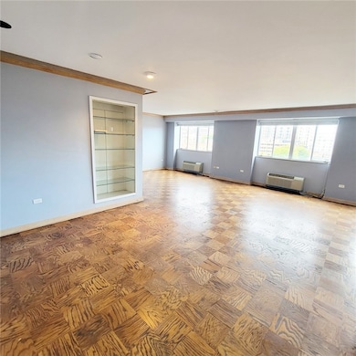 Entry flows into living area, with built-in displa