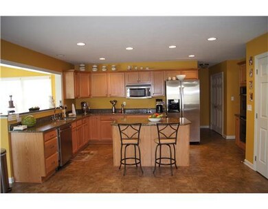 Kitchen. This open warm and rich kitchen offers pl