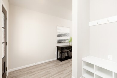 A functional mudroom awaits, with built-in storage