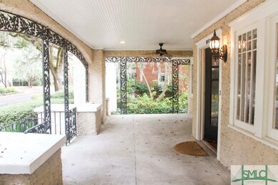 Large front porch with ceiling fans.